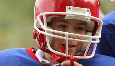 boy with sportsguard and helmet