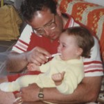 Dr. Milewski brushing his daughter Kathleen's teeth, 1986
